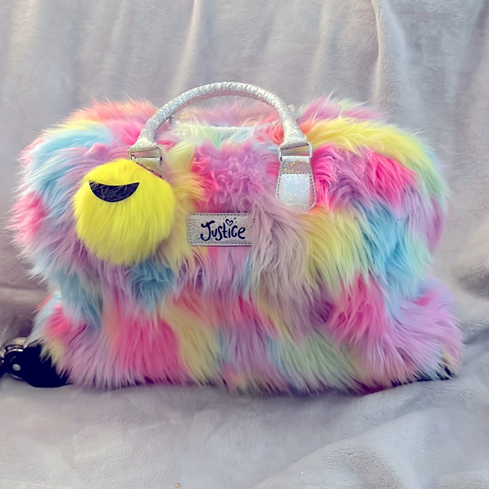 Justice Fuzzy rainbow rolling luggage bag
